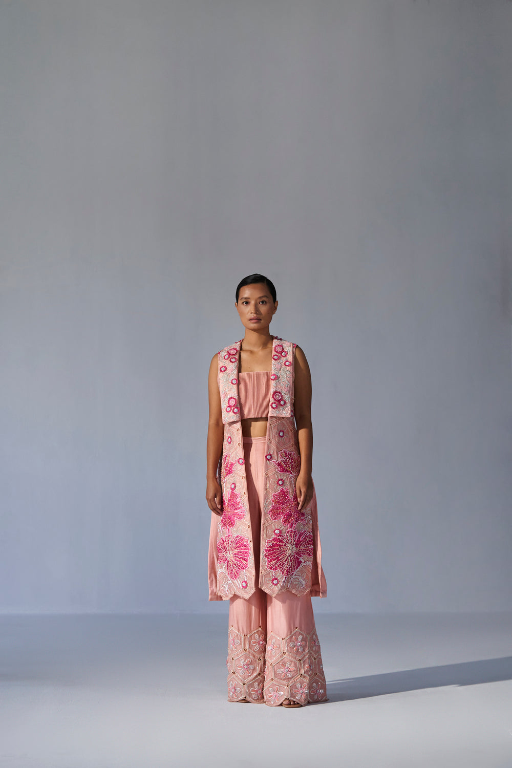 Peach collared jacket with crop top and bell bottoms