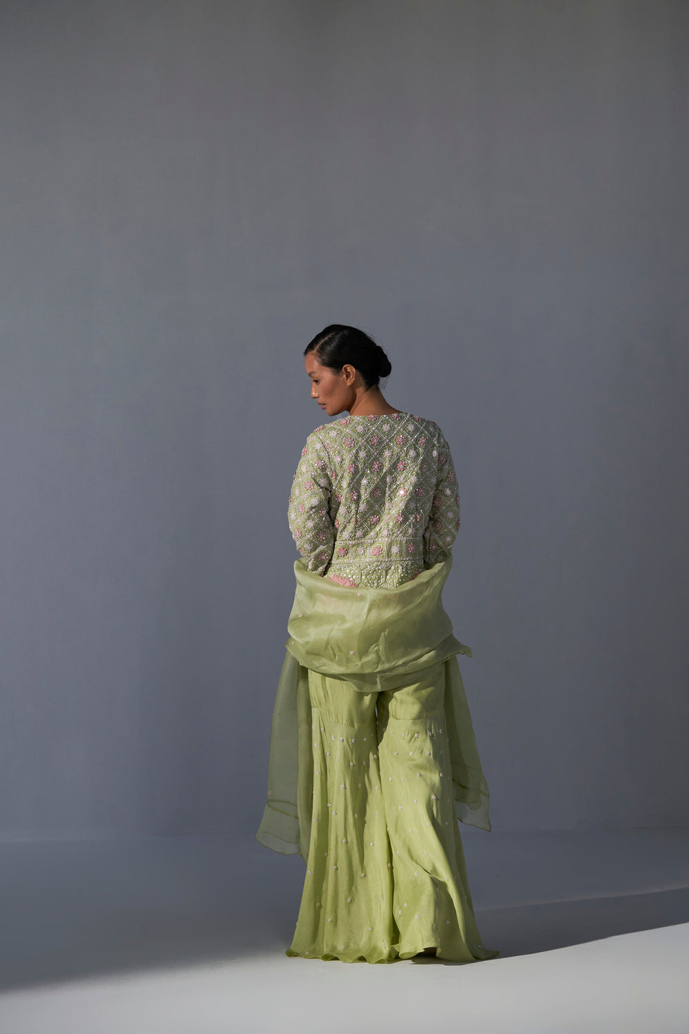 Pista Green peplum top with sharara and organza dupatta