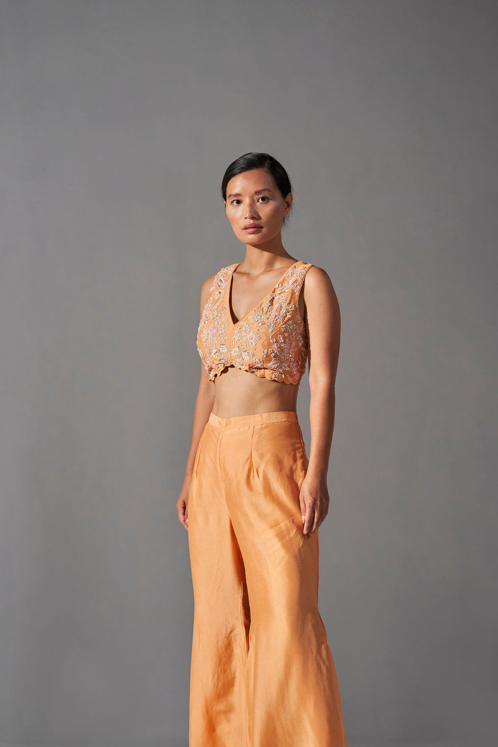 Tangerine zardozi embroidered jacket, bustier and bell bottom set