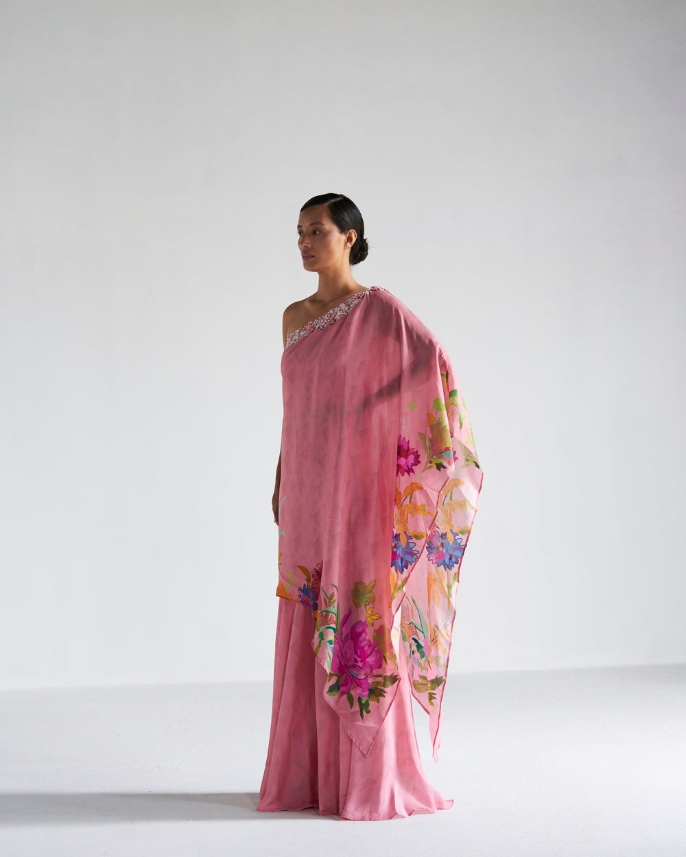 Pink floral printed one shoulder asymmetric top with sharara.