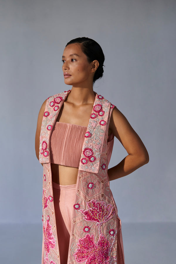Peach collared jacket with crop top and bell bottoms