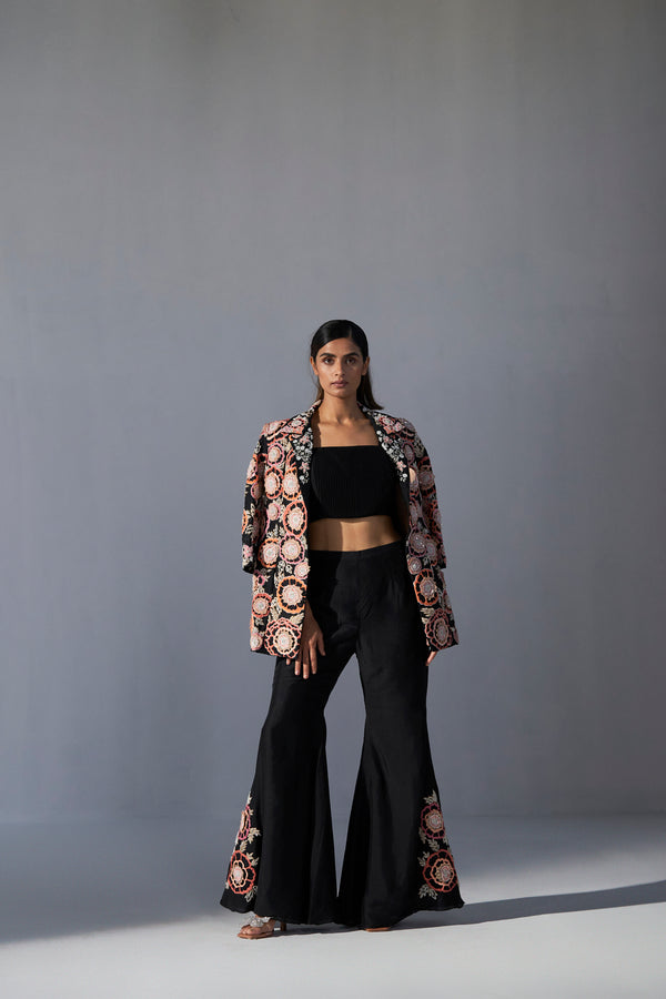 Black floral embroidered jacket with bustier and bell bottom pants