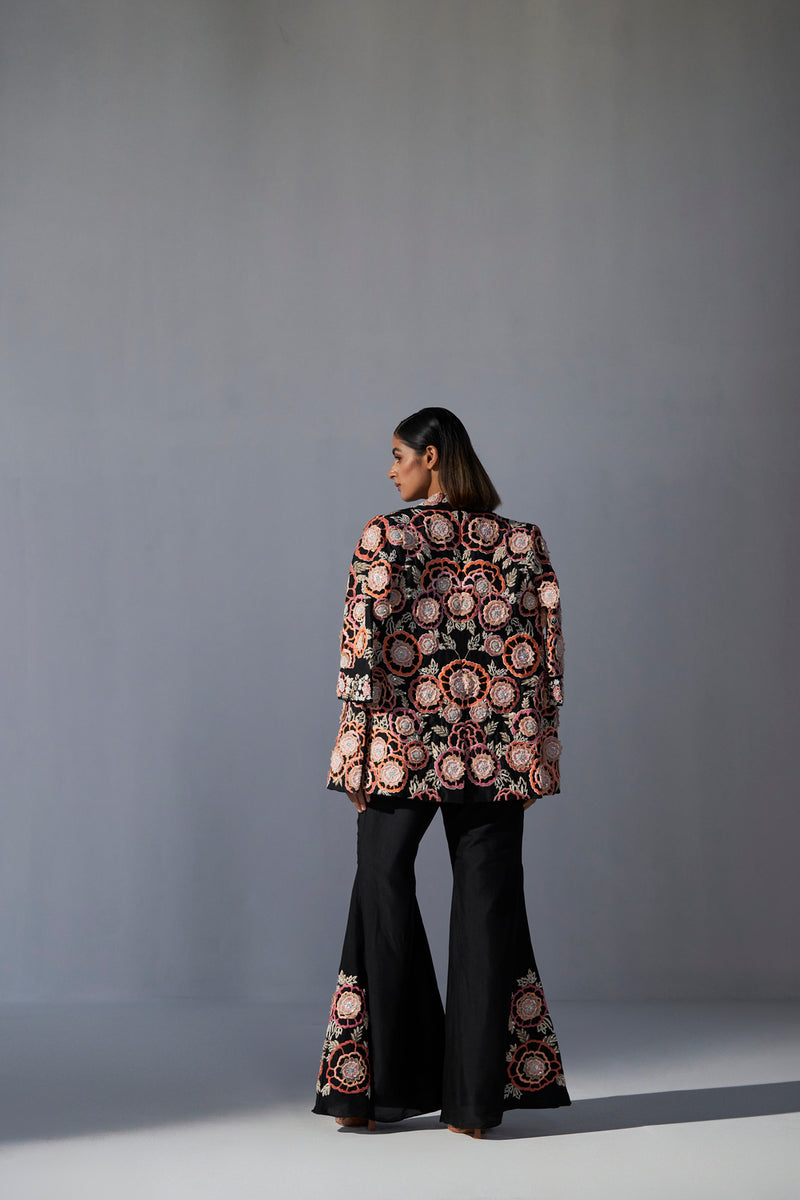 Black floral embroidered jacket with bustier and bell bottom pants