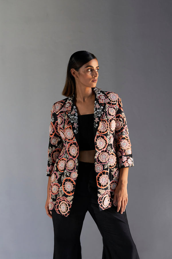 Black floral embroidered jacket with bustier and bell bottom pants