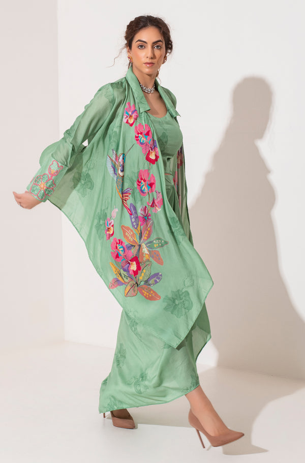 Pista green placement printed asymmetric jacket bustier and draped skirt.